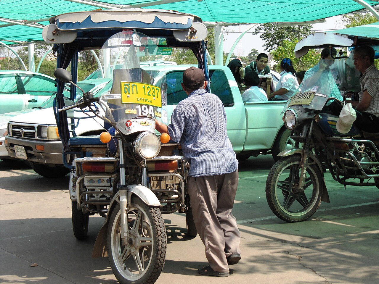 Isan tuk-tuk drivers awaiting passengers in Nakhon Phanom.